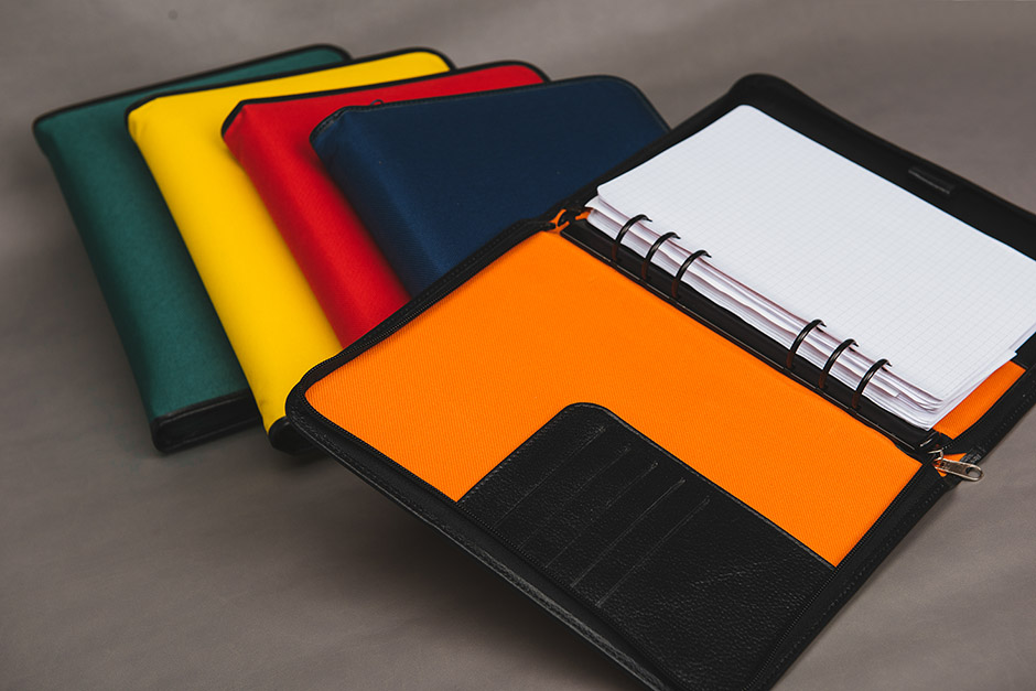 Zipper cloth and leather organizer, published and printed by Précigraph